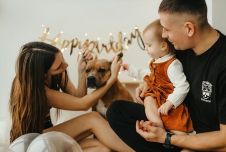 family together with their dog