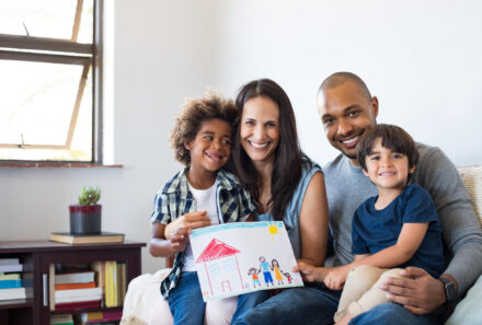 adoptive family smiling together